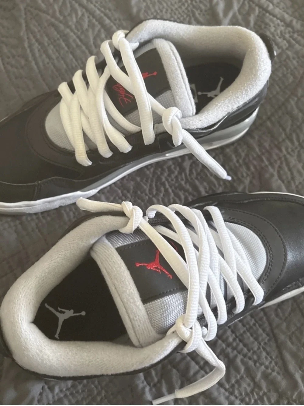 Nike Black and White Low-Top Sneakers with Red Logo